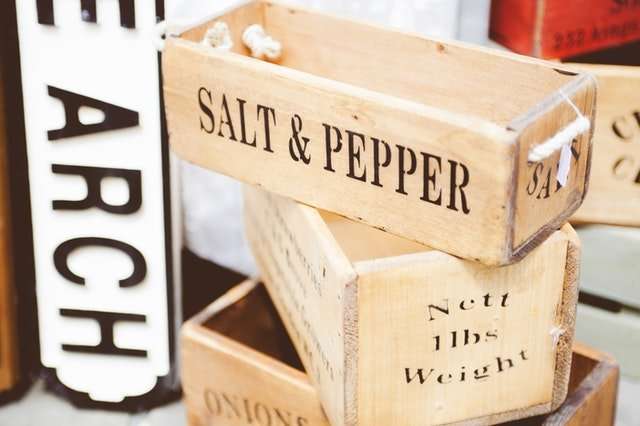 salt and pepper in small wooden boxes