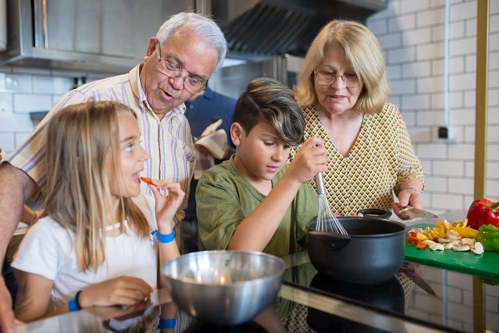 grand parents cooking with grand children