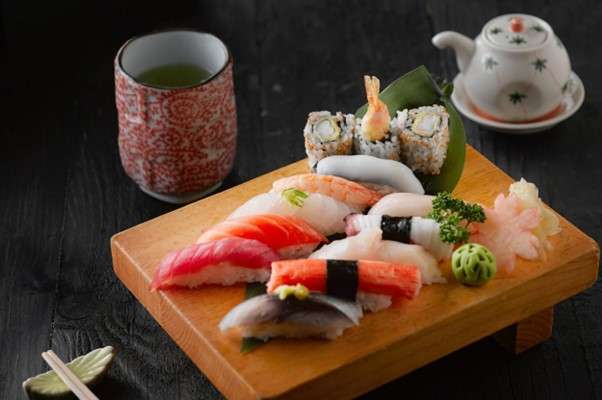 fresh salmon on a plate that sits on the table