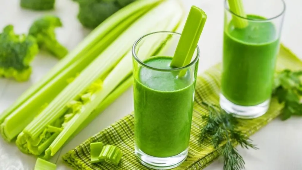 2 glasses celery juice on a table